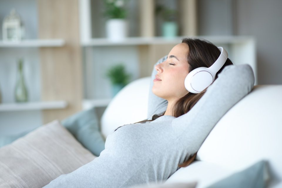 young woman on headphones relaxing