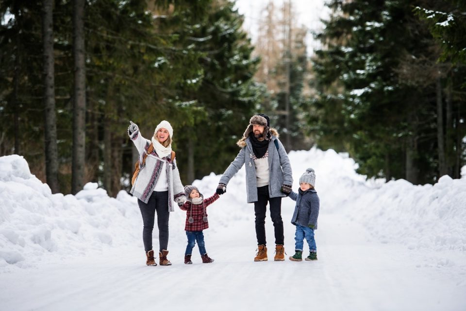 family enjoying snow walk